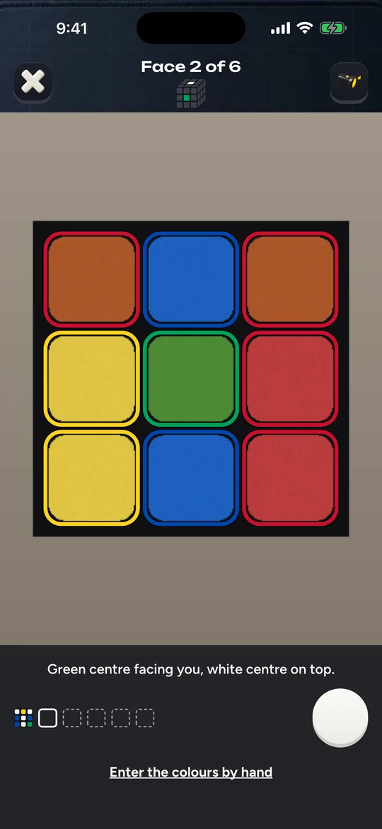 The Cubofix camera screen reading one face of the cube, each sticker outlined in the color it reads