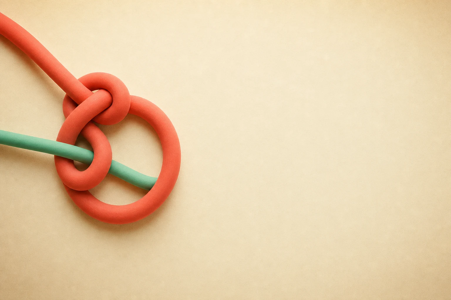 A loose coral overhand knot with a jade strand passing through it, resting on warm paper.